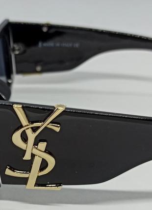 Очки в стиле yves saint laurent женские солнцезащитные большие черные с золотым логотипом5 фото