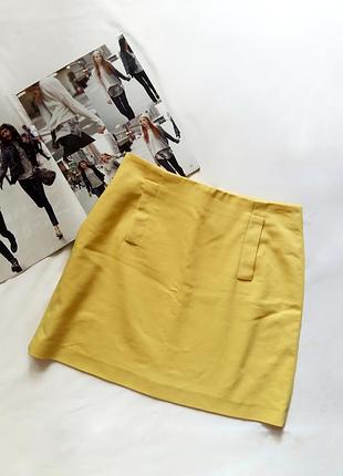 Жовта спідниця zara з двома кишенями