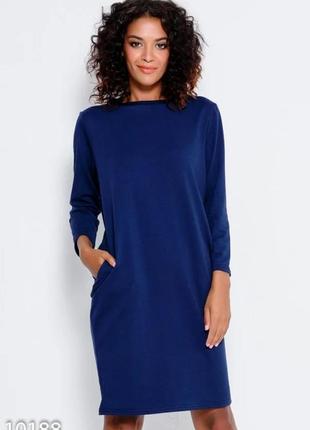 Темно-синя трикотажна сукня з довгими рукавами і кишенями1 фото