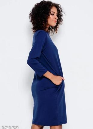 Темно-синя трикотажна сукня з довгими рукавами і кишенями2 фото