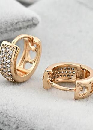 Сережки муза 40182 розмір 12х5 мм білі фіанти вага 2.7 г позолота 18к