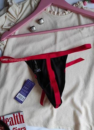 Мужские трусы стринги черные с красной резинкой и бантом открыты с доступом эрлтические