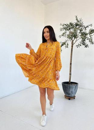 Плаття з довгим рукавом оранжевого кольору з квітковим принтом