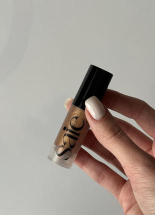 Рідкий бронзер хайлайтер бронзуючі краплі saie glowy super gel lightweight dewy multipurpose illuminator sunglow
