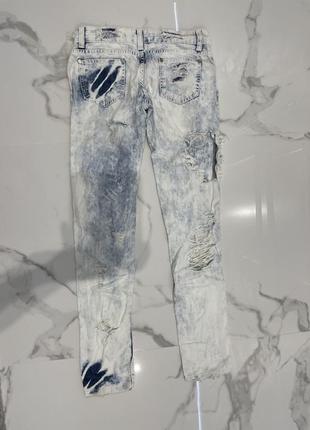 Женские рваные джинсы4 фото