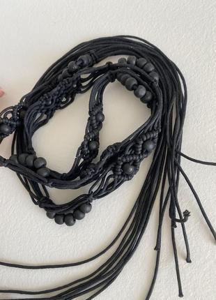 Ремень плетёный с кисточками бусинами с висюльками ремешок вязаный из жгута чёрный1 фото