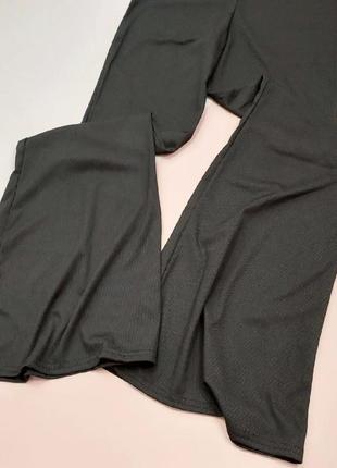 Трикотажные брюки клеш в рубчик1 фото