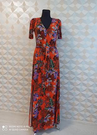Яркое стильное трикотажное макси платье с разрезом в цветах