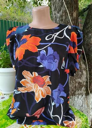 Черная с  оранжевыми цветами блуза и фиолетовыми листиками