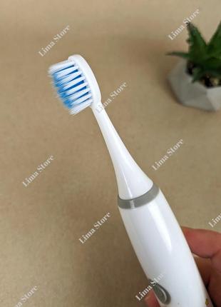 Дитяча електрична зубна щітка біла5 фото