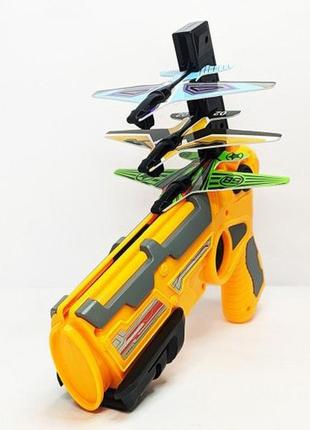 Дитячий іграшковий пістолет з літачками air battle катапульта з літаючими літаками (ab-1). колір: жовтий4 фото