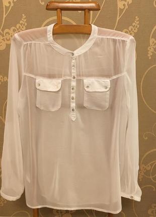 Дуже красива та стильна брендова блузка білого кольору.