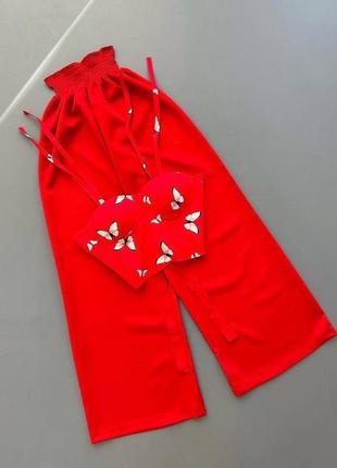 Жіночий неймовірний стильний легкий літні костюм червоні штани з червоним топом з білими метеликами2 фото