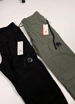 Теплые мужские штаны c.p. company с линзою черного цвета6 фото