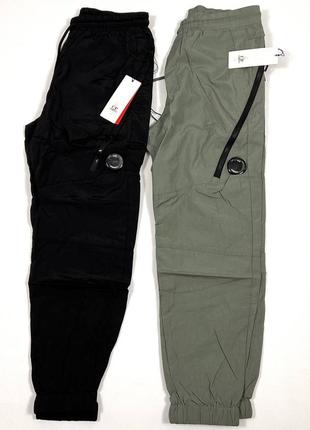 Теплые мужские штаны c.p. company с линзою черного цвета3 фото