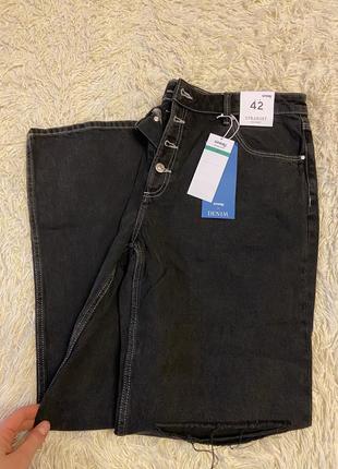 Черные порванные джинсы на пуговицах4 фото