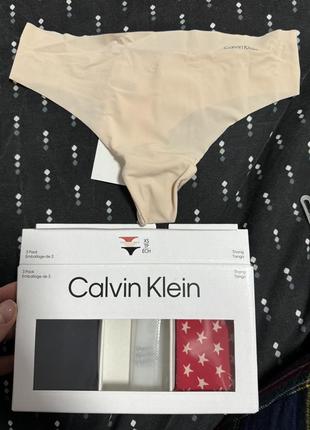 Трусики стринги calvin klein xs4 фото