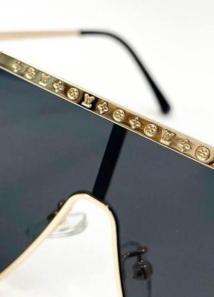 Очки солнцезащитные унисекс маска в металлической золотистой оправе с гравировкой сверху5 фото