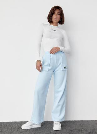 Трикотажные брюки на флисе с накладными карманами, спортивные штаны6 фото