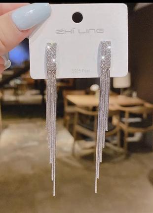 Длинные нарядные серьги серебряного цвета1 фото