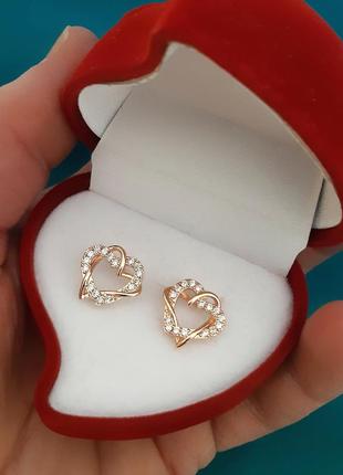 Жіночі сережки "золоте переплетення двох сердець" ювелірний сплав із цирконами - подарунок дівчині в коробочці