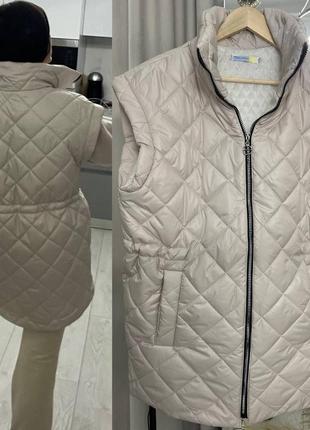 Утеплена жилетка