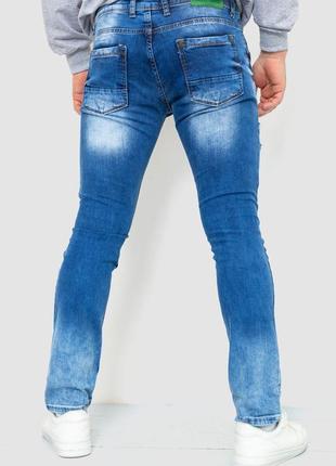 Рваные джинсы с принтом и потертостями2 фото
