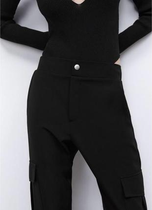 Карго брюки с накладными карманами и манжетами3 фото