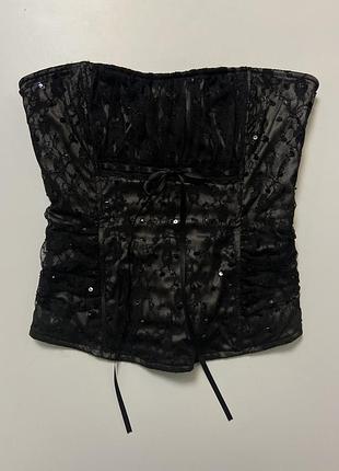 Завертаючий чорний корсет