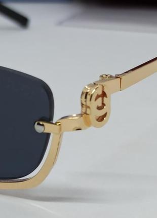 Очки в стиле gucci женские солнцезащитные модные узкие черные в золотом металле3 фото