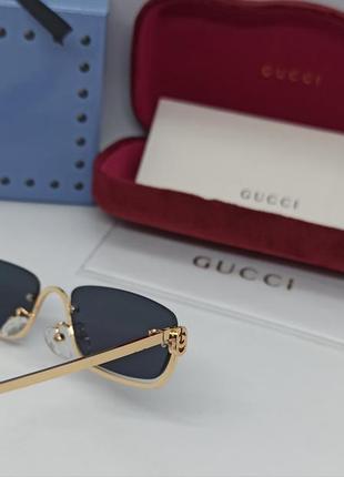 Очки в стиле gucci женские солнцезащитные модные узкие черные в золотом металле9 фото