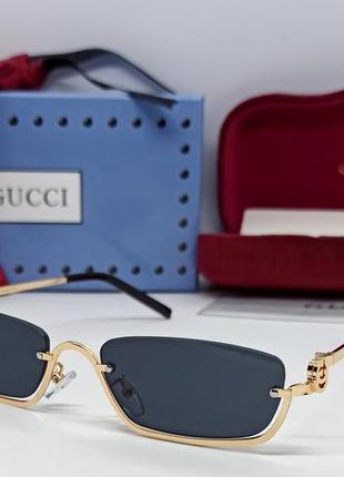 Окуляри брендовi  жіночі сонцезахисні модні вузькі чорні в золотому металі