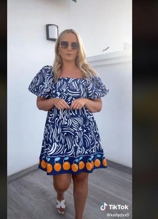 Яскрава стильна сукня бейбідол з апельсинами