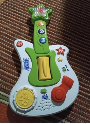 Детская игрушечная гитара в идеальном состоянии2 фото