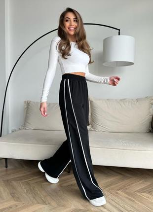 Стильные широкие брюки с боковыми тесемками