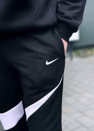 Спортивні штани nike swoosh2 фото