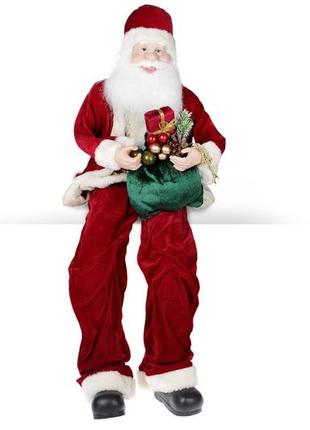 Новорічна іграшка сидячий санта 80см, колір - червоний товар від виробника