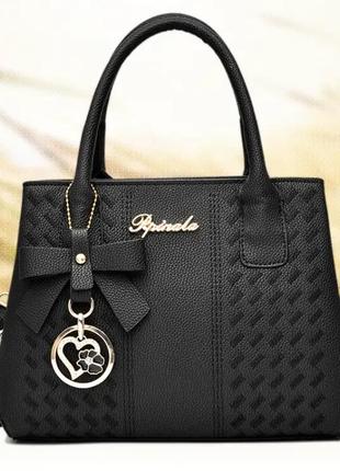 Модная женская сумка с брелком каркасная,качественная классическая дамская сумочка из эко-кожи1 фото