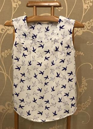 Дуже гарна і стильна брендовий блузка в мед...100% віскоза.