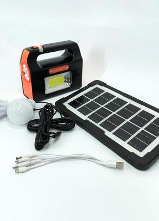 Фонарь портативный на солнечной батарее ja-2007 солнечная зарядная станция + 2 лампочки. цвет: оранжевый9 фото