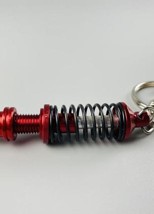 Брелок червоно-сріблястий амортизатор в зборі, авто брелок для автомобільних ключів1 фото