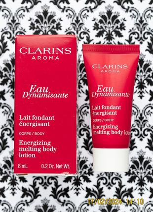 Тонизирующий лосьон для тела clarins eau dynamisante energizing melting body lotion1 фото