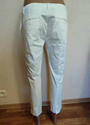 Стильные белые стрейчевые брюки брюки.9 фото