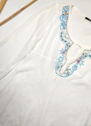 Блуза жіноча білого кольору прозора з камінням від бренду zebra m3 фото