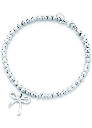 Элегантный серебряный браслет тиффани с бантом от tiffany & co: изысканное воплощение грации