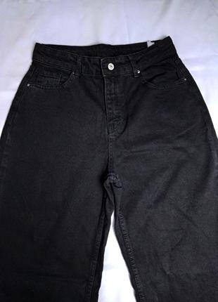 Женские джинсы палаццо с широкими штанинами черного цвета4 фото