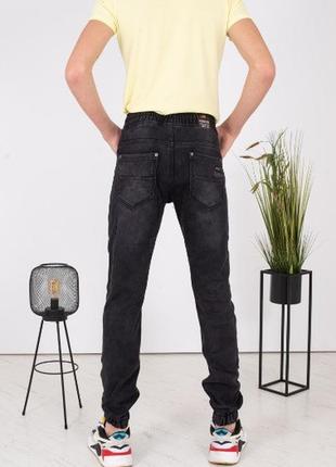 Мужские джинсы теплые на резинке джогеры на флисе темного цвета3 фото