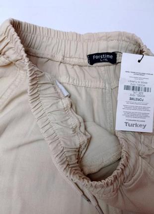 Женские штаны летние джогеры на резинке молочного цвета9 фото