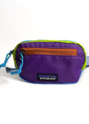 Поясная сумка patagonia ultralight black hole mini hip pack 1l синий/фиолетовый/салатный