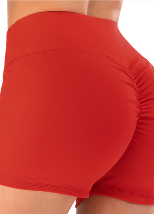 Червоні високі спортивні шорти з ефектом пуш-ап
зі збіркою на попі1 фото